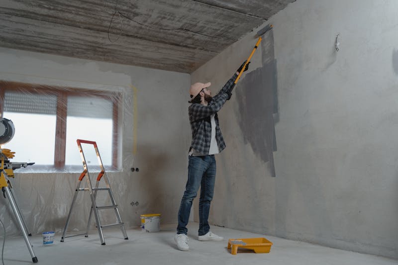 Fresh paint being applied to interior wall